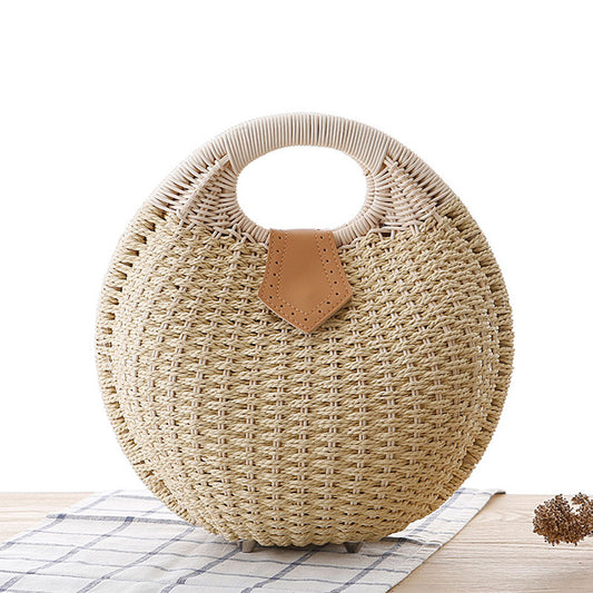 Bolso de mano redondo de ratán